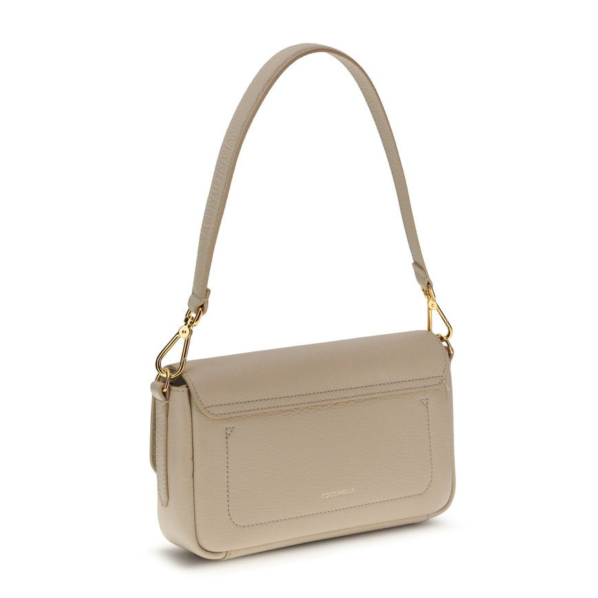 Sac bandoulière Bos Taurus en cuir de veau beige Coccinelle